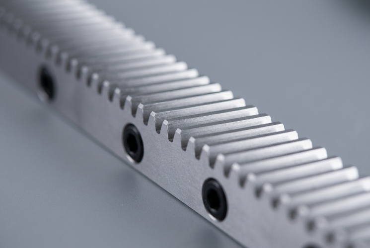 Close-up of angled spiral teeth on a precision helical rack